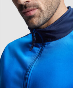 Man wearing blue sporty jacket.