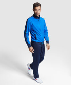 Man in blue tracksuit walking forward