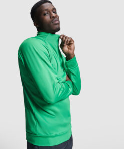 Man in green jacket looking confident