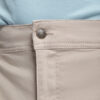 Beige bukser med metal knapdetalje